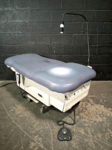 MIDMARK 623-008 EXAM TABLE WITH FOOT AND HAND CONTROLS
