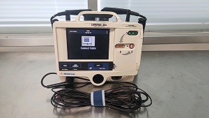 MEDTRONIC LIFEPAK 20E DEFIB WITH PACER, ANALYZE, AED MODE, ECG, ECG CABLE, PADDLES LOCATED AT 1825 S. 43RD AVE SUITE B2 PHOENIX AZ 85009