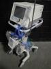 RESPIRONICS, INC. BIPAP VISION VENTILATOR WITH HUDSON RCI NEPTUNE HUMIDIFIER ON ROLLING STAND