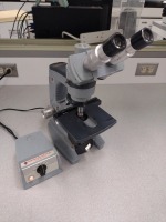 AMERICAN OPTICAL MICROSCOPE WITH 1051 OPTICAL TRANSFORMER