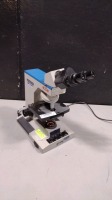 REICHERT MICROSTAR IV LAB MICROSCOPE WITH 2 OBJECTIVES 10X, X100 AND EYE PIECES