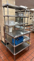 SHELVING UNIT WITH WORK SURFACE AND 5 SHELVES LOCATED AT FACILITY