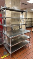 SHELVING UNIT WITH WORK SURFACE AND 5 SHELVES LOCATED AT FACILITY