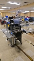 NCR CASH REGISTER WITH AVERY BERKEL SCALE ON STAINLESS CART LOCATED AT 2100 DORCHESTER AVE. DORCHESTER, MA 02124- VERIFONE CREDIT CARD MACHINES NOT INCLUDED