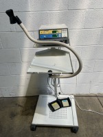 ELLMAN SURGITRON 4.0 RF ESU SYSTEM ON ROLLING STAND WITH FOOTSWITCH