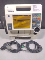 MEDTRONIC/PHYSIO-CONTROL LIFEPAK 12 BIPHASIC DEFIB WITH PACING, 3 LEAD ECG, ANALYZE, PADDLES, BATTERIES, AC ADAPTER