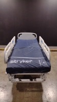 STRYKER SECURE 3005 S3 HOSPITAL BED WITH HEAD & FOOTBOARD (CHAPERONE WITH ZONE CONTROL, BED EXIT, SCALE) (IBED AWRENESS)