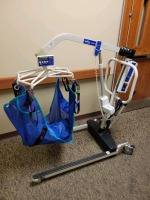 INVACARE RELIANT 600 PATIENT LIFT WITH SCALE AND EXTRA BATTERY AND WALL CHARGER