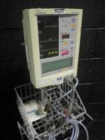 DATASCOPE ACCUTORR PLUS PATIENT MONITOR ON ROLLING STAND