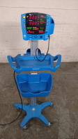 GE DINAMAP V100 VITAL SIGNS MONITOR ON ROLLING STAND