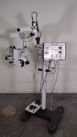 WILD HEERBRUGG WILD M690 SURGICAL MICROSCOPE WITH DUAL BINOCULARS (10X/21B GLASSES AND 10X/21 GLASSES), VIEWING ATTACHMENT (10X/21 GLASSES), BOTTOM LENS (F=200MM), FOOTSWITCH, ROLLING STAND