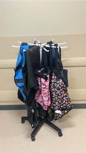 ROLLING X-RAY GARMENT RACK W/ ASSORTED GARMENTS LOCATED AT: LOCATED AT: 1 MEDICAL CENTER BLVD, CHESTER, PA 19013 4/OR 2