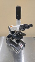 NIKON LABOPHOT 2 LAB MICROSCOPE W/ 2 OCULAR LENSES, 4 OBJECTIVE LENSES AND CAMERA ATTAC HMENT LOCATED AT: LOCATED AT: 1 MEDICAL CENTER BLVD, CHESTER, PA 19013 1/ LOBBY