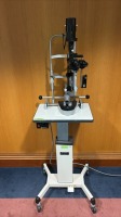 MARCO MARCO V SLIT LAMP WITH 2 OBJECTIVE LENSES AND CAMERA ATTACHMENT ON TOPCON IT-1 ADJUSTABLE INSTRUMENT TABLE LOCATED AT: LOCATED AT: 1 MEDICAL CENTER BLVD, CHESTER, PA 19013