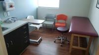 EXAM ROOM TO INCLUDE: EXAM TABLE, EXAM STOOL AND 2 CHAIRS