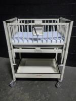 HARD INFANT CRIB