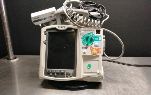 PHILIPS HEARTSTART MRX DEFIBRILLATOR W/PADDLES AND M3725A OHM TEST LOAD