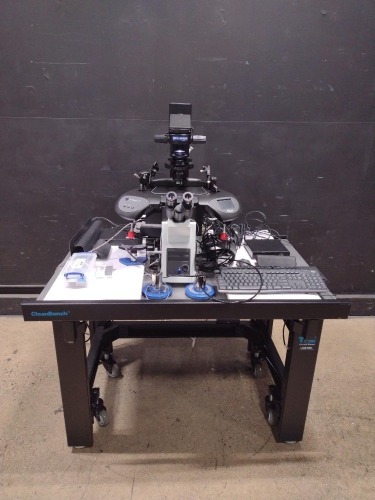 OLYMPUS IX73 LAB MICROSCOPE WITH 6 OBJECTIVES AND EYE PIECES 10X/22, WITH DELL OPTI PLEX 3080 MICRO PC, RI SATURN 5 ACTIVE LASER SYSTEM AND INTEGRA 3 MICROMANIPULATOR ON A CLEAN BENCH TABLE