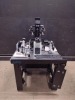 OLYMPUS IX73 LAB MICROSCOPE WITH 5 OBJECTIVES AND EYE PIECES 10X/22, WITH NARUSHIGE, NARISHIGE EQUIPMENT, DELL D15U PC, RI SATURN 5 ACTIVE LASER SYSTEM ON A CLEAN BENCH TABLE