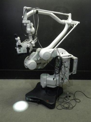 LEICA NC 4 SURGICAL MICROSCOPE WITH SINGLE BINOCULARS (10X/21) WITH BOTTOM LENS (WD 207...407MM), WITH ILO XL300 LIGHT SOURCE, ON MITAKA KOHKI ROLLING STAND