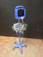 GE PROCARE VITAL SIGN MONITOR ON ROLLING STAND