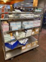 CART AND CONTENTS TO INCLUDE: ASSORTED SURGICAL TAPE, DRAPE CLAMPS, AND TUBING LOCATION: 2 CAF.