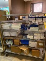 CART AND CONTENTS TO INCLUDE: GAUZE SPONGES, FOLEY CATHETER TRAYS, AND ECG ELECTRODES LOCATION: 2 CAF.