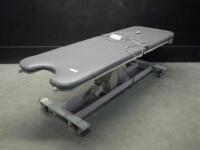 MEDICAL POSITIONING INC. POWER TREATMENT TABLE WITH HAND CONTROL