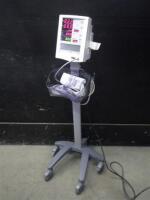 DATASCOPE ACCUTORR PLUS PATIENT MONITOR WITH BP CABLE ON ROLLING STAND