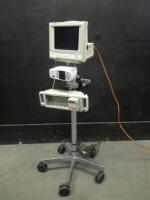 RAD-87/M1204A MONITORING SYSTEM TO INCLUDE: CMS24 OMNICARE PATIENT MONITOR, RAD-87 PULSE OX, MODULE RACK ON ROLLING STAND