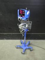 GE DINAMAP V100 CARESCAPE VITAL SIGNS MONITOR WITH CABLES (SPO2, BP) ON ROLLING STAND