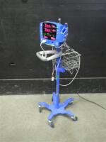 GE DINAMAP V100 CARESCAPE VITAL SIGNS MONITOR WITH SPO2 CABLE ON ROLLING STAND
