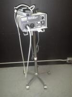 LUXTEC SERIES 1300 LIGHT SOURCE WITH HEADSET ON ROLLING STAND