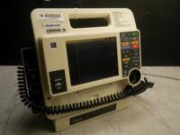 MEDTRONIC/PHYSIO-CONTROL LIFEPAK 12 BIPHASIC DEFIB WITH PACING, 3 LEAD ECG, SPO2, NIBP, ANALYZE, PADDLES, BATTERY