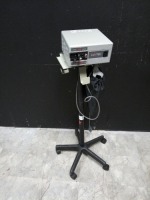 LUXTEC 9100 LIGHT SOURCE WITH HEADSET ON ROLLING STAND