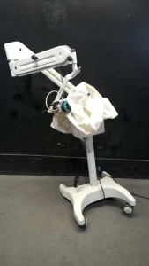 GLOBAL SURGICAL MICROSCOPE WITH SINGLE BINOCULAR (M1010A) AND BOTTOM LENS (M1028G-250) ON ROLLING STAND