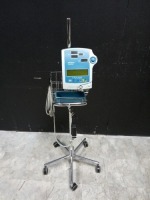 CRITIKON DINAMAP COMPACT BP VITAL SIGN MONITOR ON ROLLING STAND