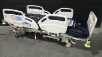 HILL-ROM CAREASSIST ES HOSPITAL BED W/SCALE & FOOTBOARD