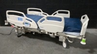 HILL-ROM CAREASSIST HOSPITAL BED W/SCALE & FOOTBOARD