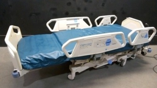 HILL-ROM P1900 TOTALCARE HOSPITAL BED WITH CPR AND FOOT BOARD