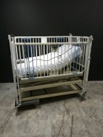 HARD INFANT CRIB (MISSING WHEEL)