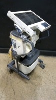 NELLCOR PURITAN BENNET 840 VENTILATOR WITH AIR COMPRESSOR ON ROLLING STAND (BILEVEL, VV+, PAV+, TC, RM, TRENDING, LC) (SERIAL NO. 4200154001)