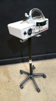 LUXTEC SERIES 9000 LIGHT SOURCE WITH HEADSET ON ROLLING STAND