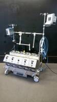 COBE CENTURY 043605-00 BLOOD PERFUSION SYSTEM WITH 5 ROLLER PUMPS, CHRONOTHERM MONITOR, AIR EMBOLI PROTECTION SYSTEM MONITOR ON ROLLING STAND