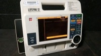 MEDTRONIC LIFEPAK 12 DEFIB WITH ECG,PACING,ANALYZE,BATTERIES