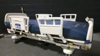 STRYKER 2030 HOSPITAL BED W/SCALE & FOOTBOARD