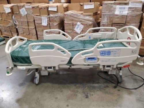 HILL-ROM CAREASSIST HOSPITAL BED W/SCALE,HEAD & FOOTBOARDS located at 902 nicholson road suite 200 Garland, TX 75042