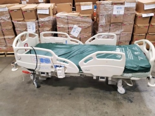 HILL-ROM CAREASSIST HOSPITAL BED W/SCALE,HEAD & FOOTBOARDS located at 902 nicholson road suite 200 Garland, TX 75042