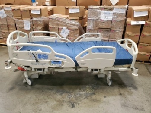 HILL-ROM CAREASSIST HOSPITAL BED W/SCALE,HEAD & FOOTBOARDS located at 902 nicholson road suite 200 Garland, TX 75042