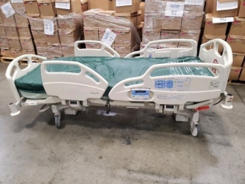 HILL-ROM CAREASSIST HOSPITAL BED W/SCALE,HEAD & FOOTBOARDS located at 902 nicholson road suite 200 Garland, TX 75042